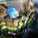 Sheri Bly cuts the driver's door using a hydraulic cutter