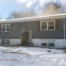 Smoke hangs over the alpha-delta corner of a house with a room and contents fire on Livermore