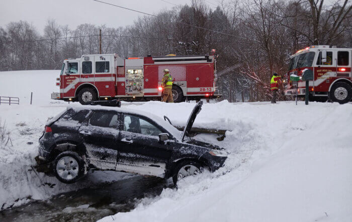 Vehicle in the ditch along Tamarack Drive